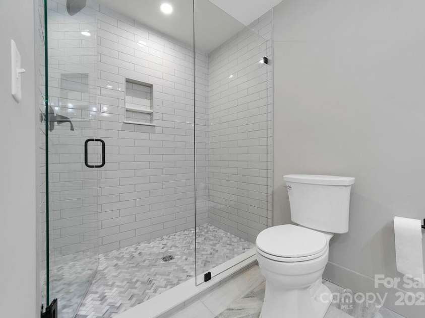 7321 Greenville Highway, Brevard, NC 28712.  MLS# CAR4302860, YatesRealty ID 3738. Custom Tile Shower