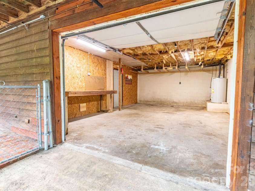4105 Pickens Highway, Rosman, NC 28772.  MLS# CAR4386563, YatesRealty ID 37389. Looking in to the oversized single car garage that can also be a wonderful workshop! Or both at the same time!