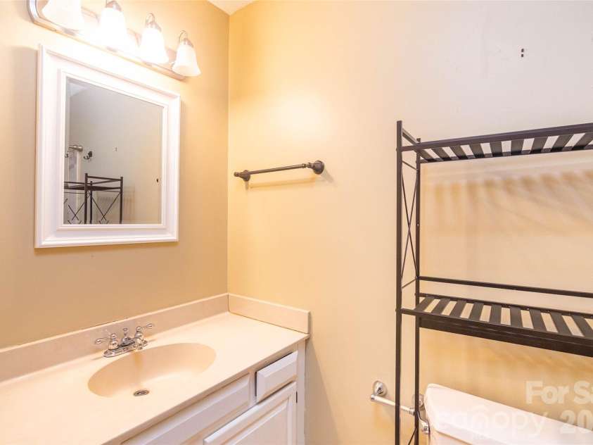4105 Pickens Highway, Rosman, NC 28772.  MLS# CAR4386563, YatesRealty ID 37389. Primary bedroom has this ensuite bathroom, here looking left.