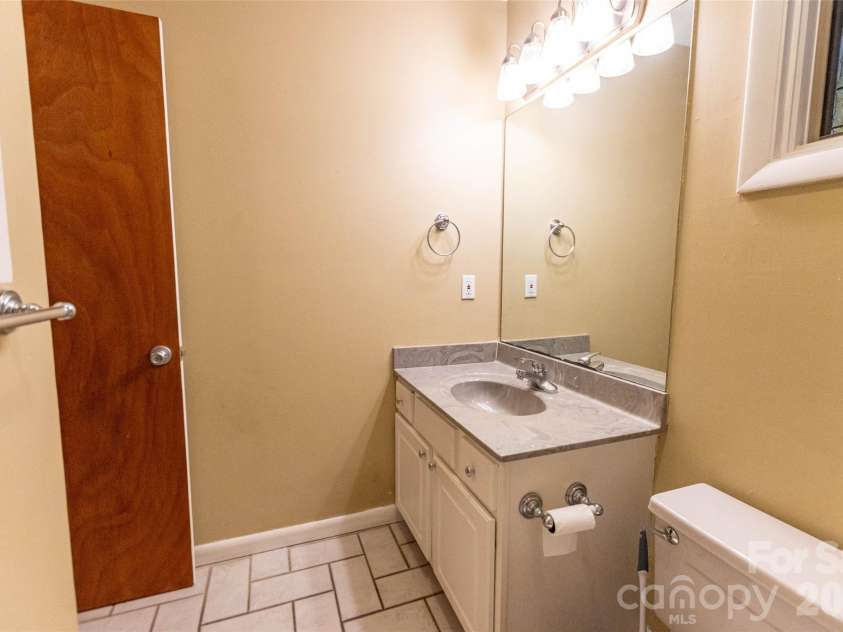 4105 Pickens Highway, Rosman, NC 28772.  MLS# CAR4386563, YatesRealty ID 37389. Second bathroom on the main level has tile floors and a nice vanity.!