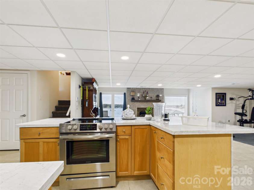 117 Summersong Lane, Mooresville, NC 28117.  MLS# CAR4383546, YatesRealty ID 37394. Lower level kitchen area