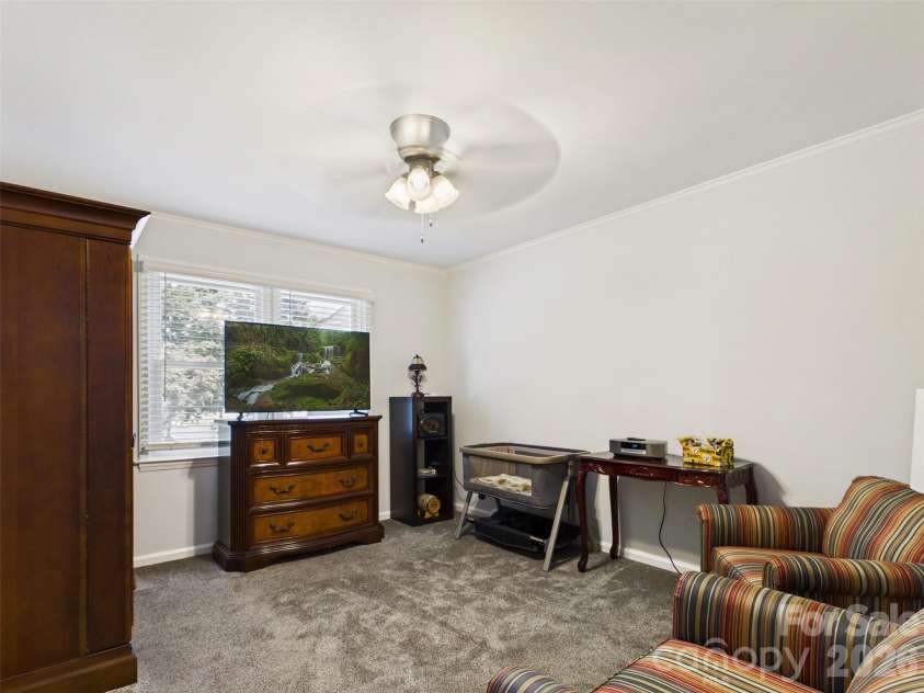 117 Summersong Lane, Mooresville, NC 28117.  MLS# CAR4383546, YatesRealty ID 37394. Main floor tv room