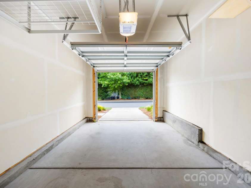 2459 Diplomat Lane, Charlotte, NC 28210.  MLS# CAR4398345, YatesRealty ID 37397. The attached garage provides secure parking along with additional storage space.