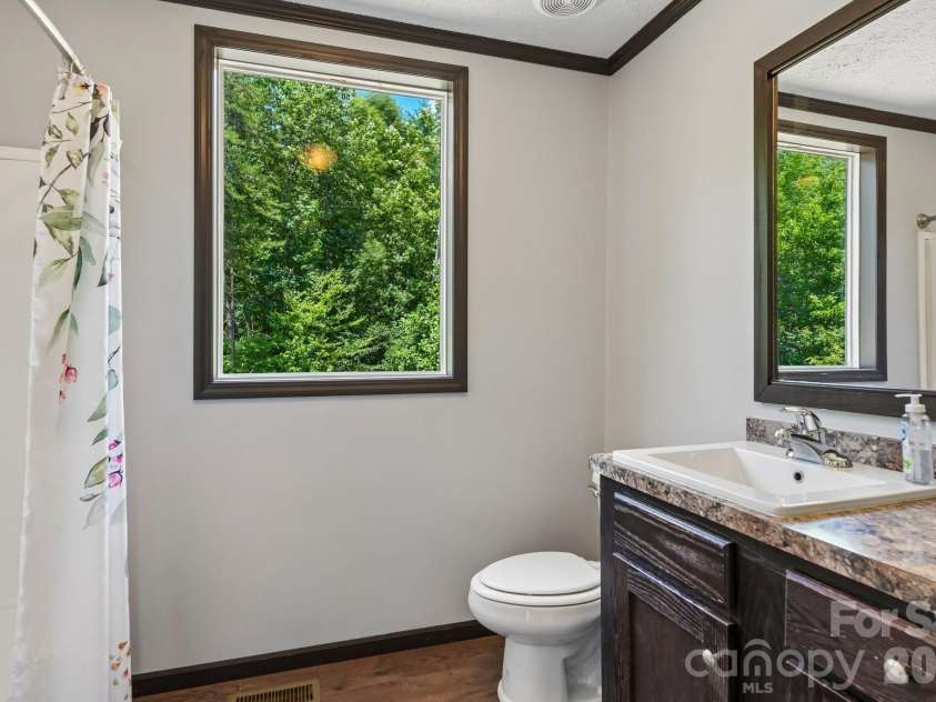 5531 Dalmation Street, Iron Station, NC 28080.  MLS# CAR4402913, YatesRealty ID 37413. Secondary bathroom