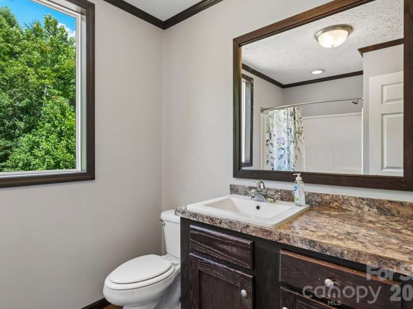 5531 Dalmation Street, Iron Station, NC 28080.  MLS# CAR4402913, YatesRealty ID 37413. Secondary bathroom