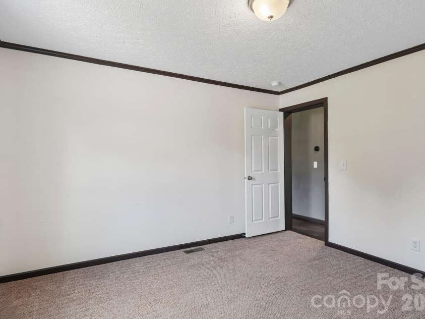 5531 Dalmation Street, Iron Station, NC 28080.  MLS# CAR4402913, YatesRealty ID 37413. Secondary bedroom