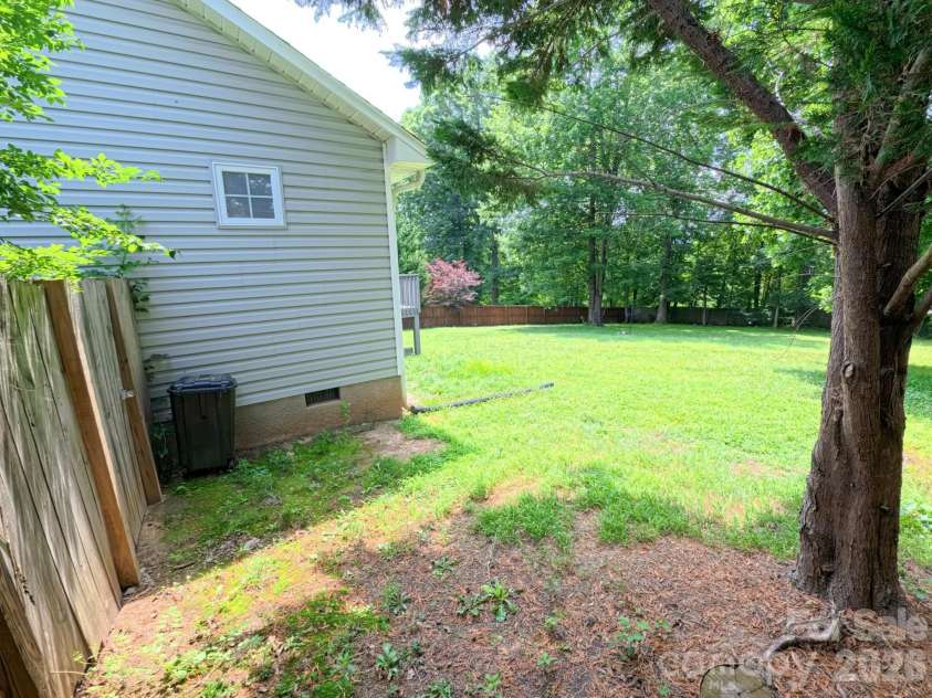 101 Tail Feather Lane, Candler, NC 28715.  MLS# CAR4398430, YatesRealty ID 37414. Big level backyard