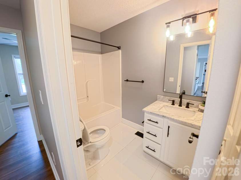 101 Tail Feather Lane, Candler, NC 28715.  MLS# CAR4398430, YatesRealty ID 37414. Guest Bathroom