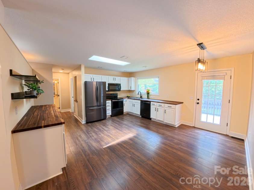 101 Tail Feather Lane, Candler, NC 28715.  MLS# CAR4398430, YatesRealty ID 37414. Kitchen towards hallway