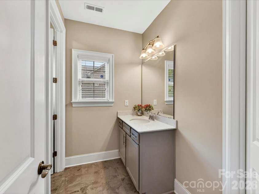 2028 Perry Pond Drive, Waxhaw, NC 28173.  MLS# CAR4383603, YatesRealty ID 37422. Main level guest bath
