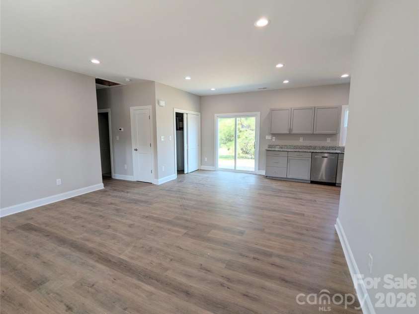 258 East Avenue, Monroe, NC 28110.  MLS# CAR4398935, YatesRealty ID 37423. Living Room looking towards Dining Area