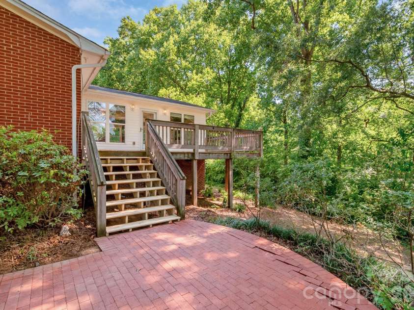 2520 Austin Chaney Road, Wingate, NC 28174.  MLS# CAR4400430, YatesRealty ID 37425. Deck coming down to Patio