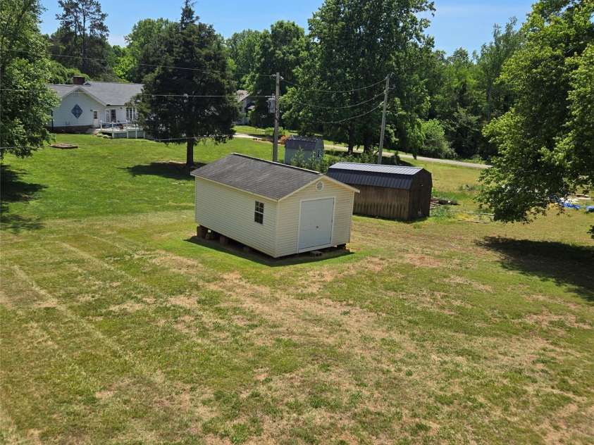 131 Morvue Loop, Statesville, NC 28625.  MLS# CAR4375122, YatesRealty ID 37436. Back yard and shed
