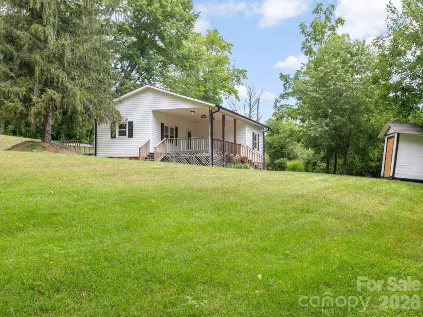 47 Carolina Mountain Drive, Candler, NC 28715.  MLS# CAR4403148, YatesRealty ID 37439. Second front view showing large yard