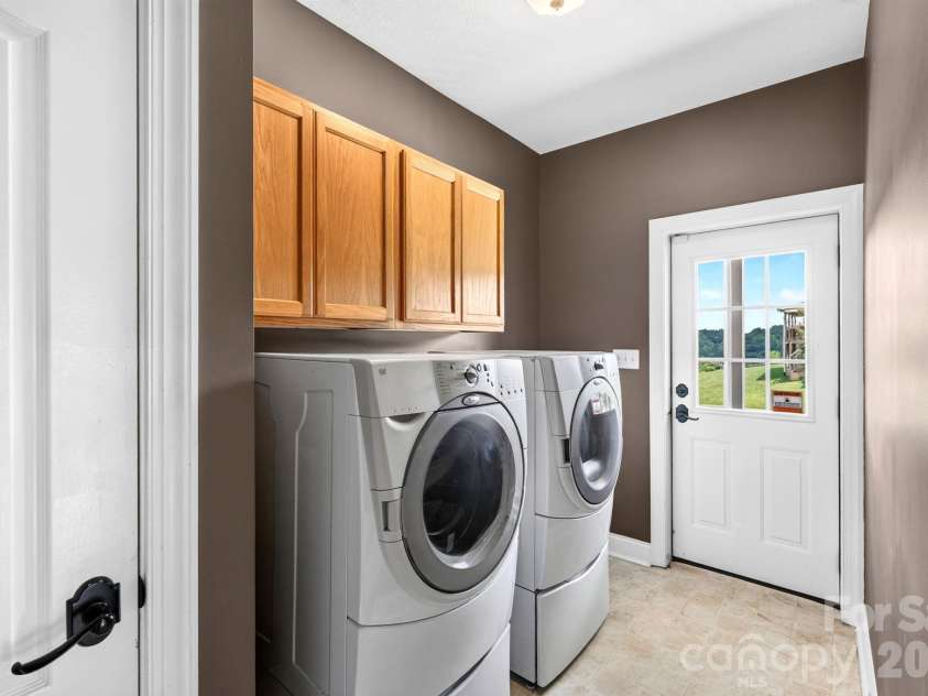 93 Big Sky Drive, Leicester, NC 28748.  MLS# CAR4403278, YatesRealty ID 37449. Laundry Room with Deck Access
