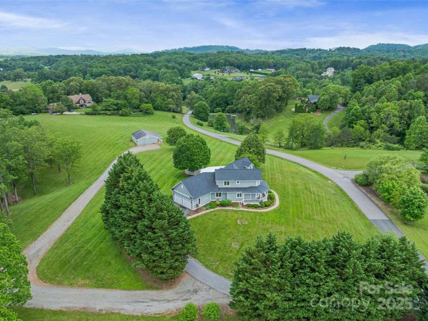 55 Plantation Drive, Asheville, NC 28806.  MLS# CAR4230730, YatesRealty ID 3745. Aerial View showing home, horse stables & grounds. Peaceful, private setting, thoughtfully planned out.