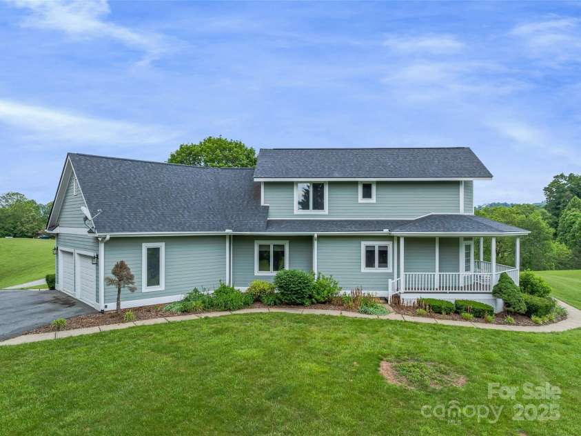 55 Plantation Drive, Asheville, NC 28806.  MLS# CAR4230730, YatesRealty ID 3745. Side View of Home with garage entry.