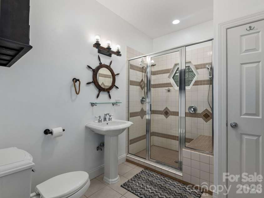 49 Indian Ridge Trail, Hendersonville, NC 28739.  MLS# CAR4401659, YatesRealty ID 37471. Main level half-bath