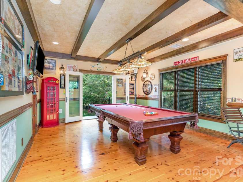 133 Brick Kiln Way, Mooresville, NC 28117.  MLS# CAR4297139, YatesRealty ID 3749. Bar/Rec room has french doors leading to an exterior Sprial staircase to access the back yard.