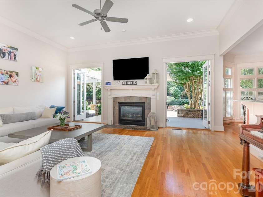 133 Brick Kiln Way, Mooresville, NC 28117.  MLS# CAR4297139, YatesRealty ID 3749. Welcoming fireplace framed by French doors that open to Stone Patio. Perfect for entertaining
