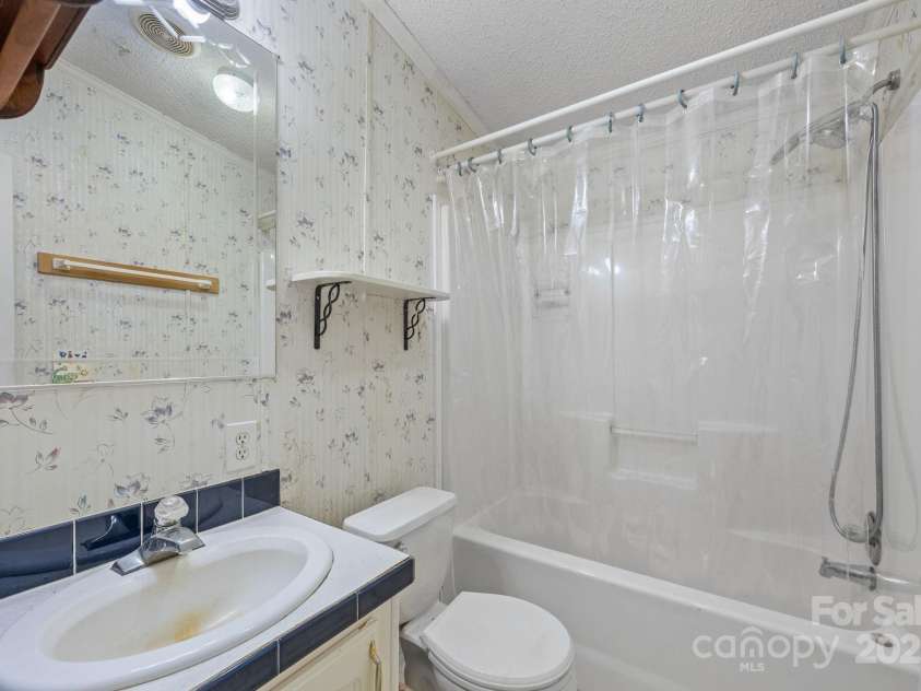 74 Davis Chapel Road, Candler, NC 28715.  MLS# CAR4311937, YatesRealty ID 3750. Second bathroom