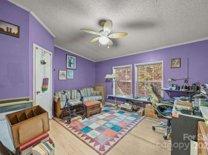 74 Davis Chapel Road, Candler, NC 28715.  MLS# CAR4311937, YatesRealty ID 3750. Second bedroom used as an office and storage