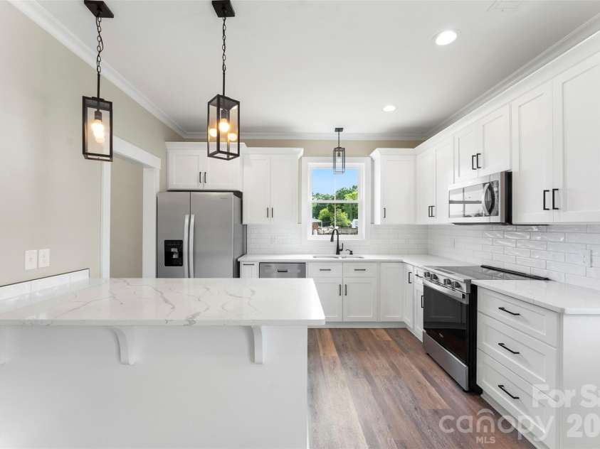 1028 Speight Road, Albemarle, NC 28001.  MLS# CAR4405298, YatesRealty ID 37504. Custom Kitchen w Quartz Countertops