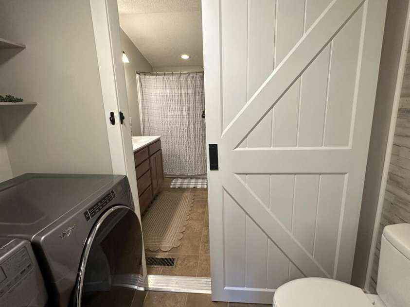 724 Johnson Farm Road, Hiddenite, NC 28636.  MLS# CAR4405354, YatesRealty ID 37515. Laundry room with half bath