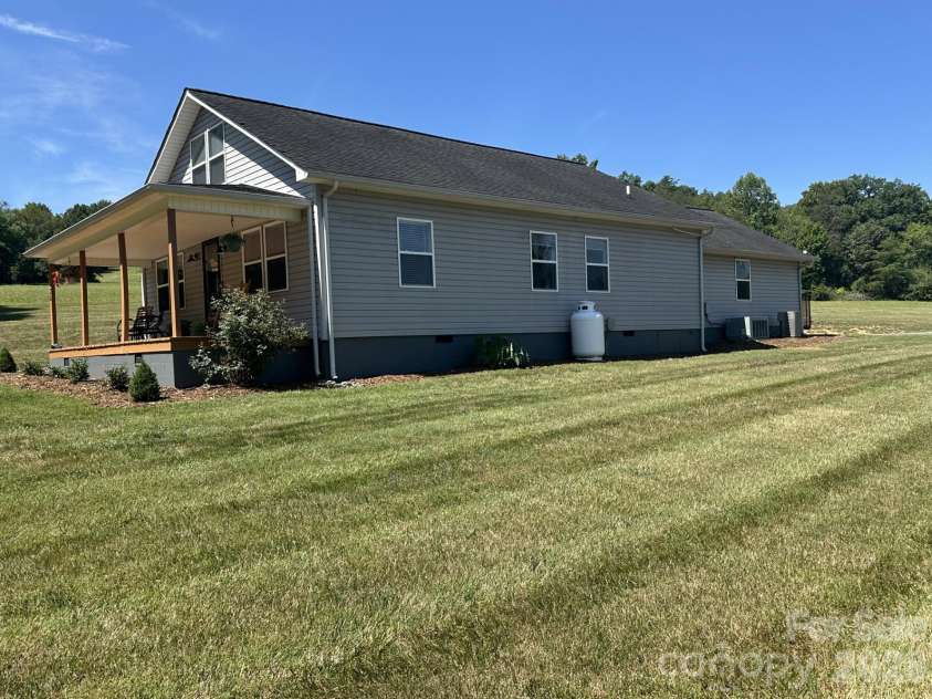724 Johnson Farm Road, Hiddenite, NC 28636.  MLS# CAR4405354, YatesRealty ID 37515. Side view