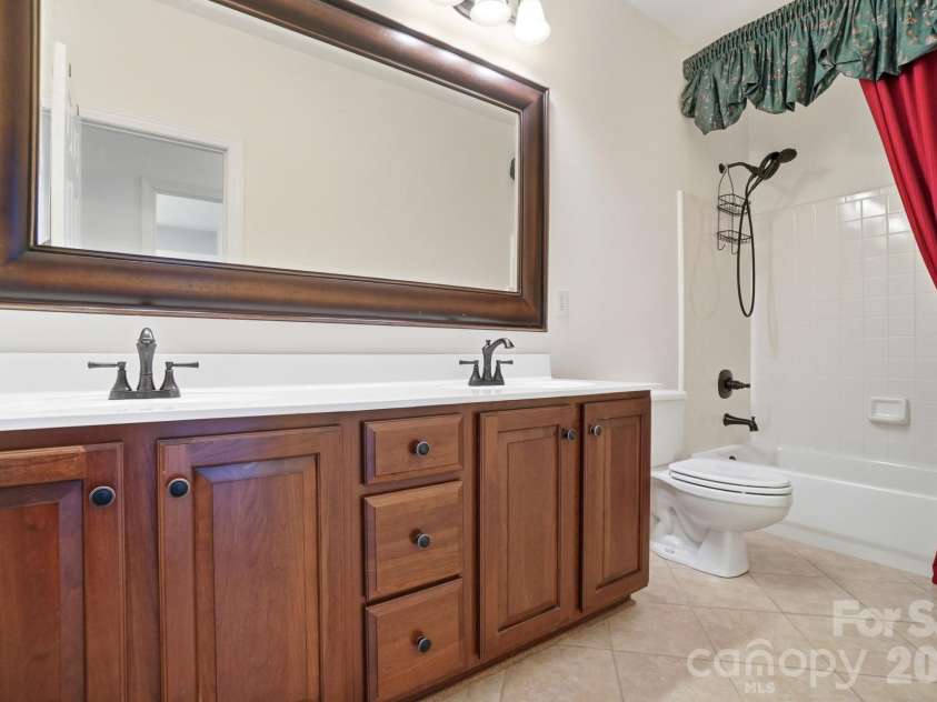 8044 Hawk Crest Court, Charlotte, NC 28270.  MLS# CAR4267919, YatesRealty ID 3752. Full bathroom upstairs- extended vanity, dual sinks, tile flooring and tub/shower combo