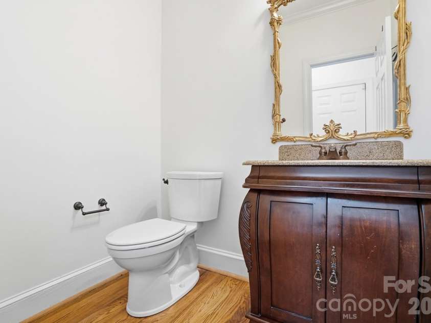 8044 Hawk Crest Court, Charlotte, NC 28270.  MLS# CAR4267919, YatesRealty ID 3752. Half bath on main level with decorative vanity