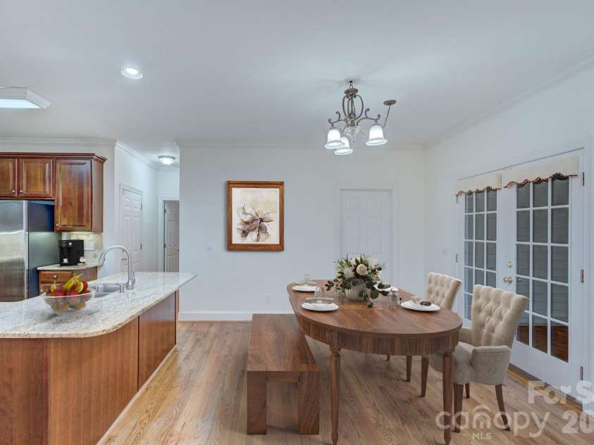 8044 Hawk Crest Court, Charlotte, NC 28270.  MLS# CAR4267919, YatesRealty ID 3752. Virtually staged-Eat in breakfast area- French doors open to the screen porch area
