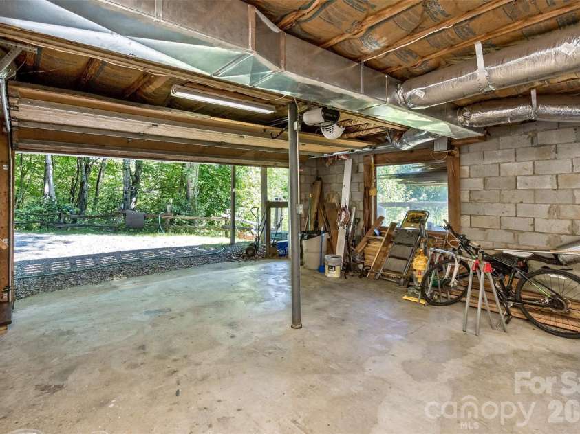 1059 Setzer Cove Road, Maggie Valley, NC 28751.  MLS# CAR4388109, YatesRealty ID 37523. Garage/basement under house