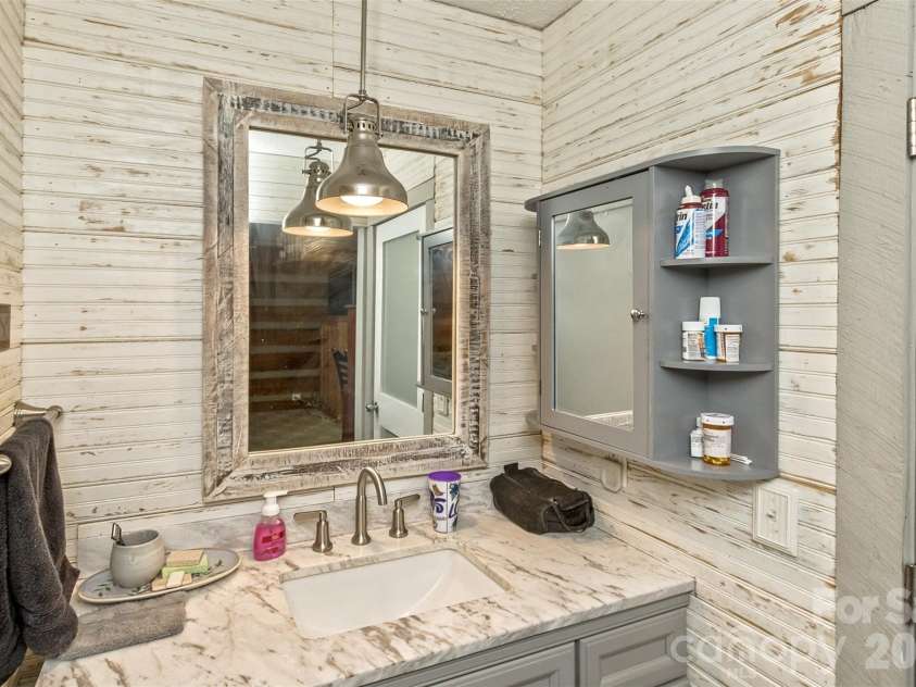 1059 Setzer Cove Road, Maggie Valley, NC 28751.  MLS# CAR4388109, YatesRealty ID 37523. Master Bath Vanity
