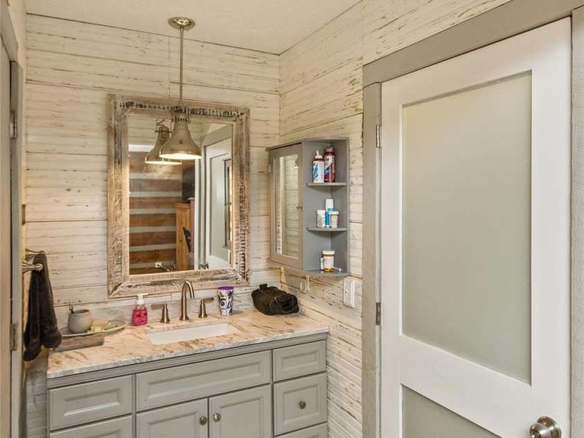 1059 Setzer Cove Road, Maggie Valley, NC 28751.  MLS# CAR4388109, YatesRealty ID 37523. Master Vanity full view