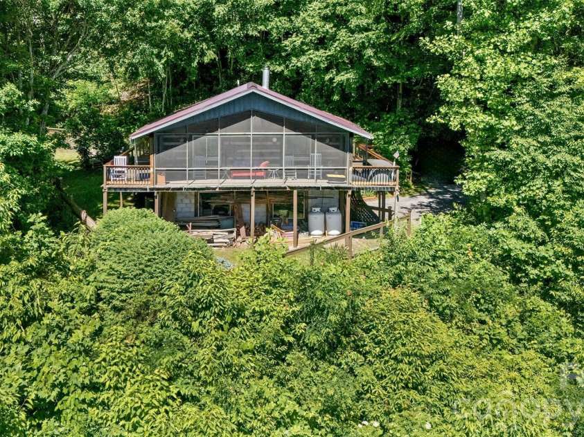 1059 Setzer Cove Road, Maggie Valley, NC 28751.  MLS# CAR4388109, YatesRealty ID 37523. Screen porch side