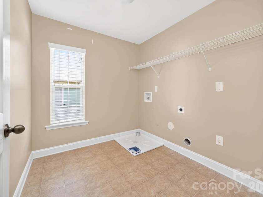 4708 Kiddle Lane, Monroe, NC 28110.  MLS# CAR4403403, YatesRealty ID 37541. Large laundry room on the upper level
