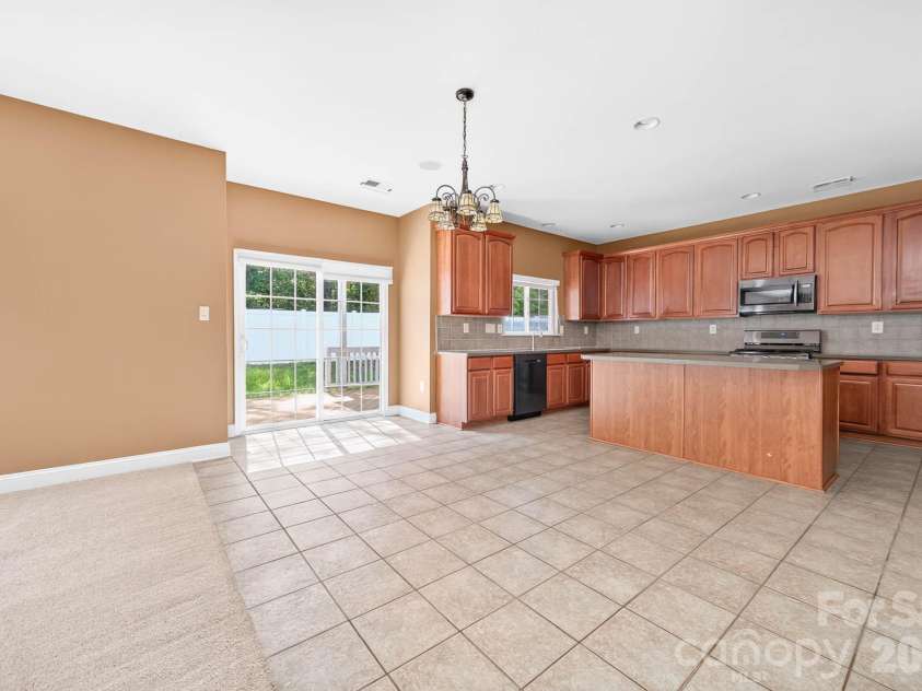 4708 Kiddle Lane, Monroe, NC 28110.  MLS# CAR4403403, YatesRealty ID 37541. Sliding doors leading out to the back deck area