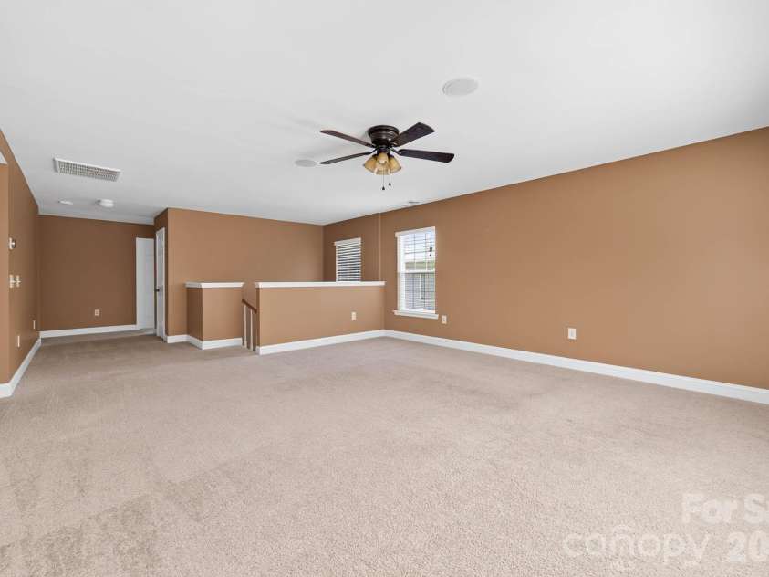 4708 Kiddle Lane, Monroe, NC 28110.  MLS# CAR4403403, YatesRealty ID 37541. The stairwell leading to the large open loft area
