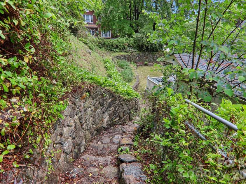 1157 Main Street, Waynesville, NC 28786.  MLS# CAR4385307, YatesRealty ID 37569. Steps to upper back yard
