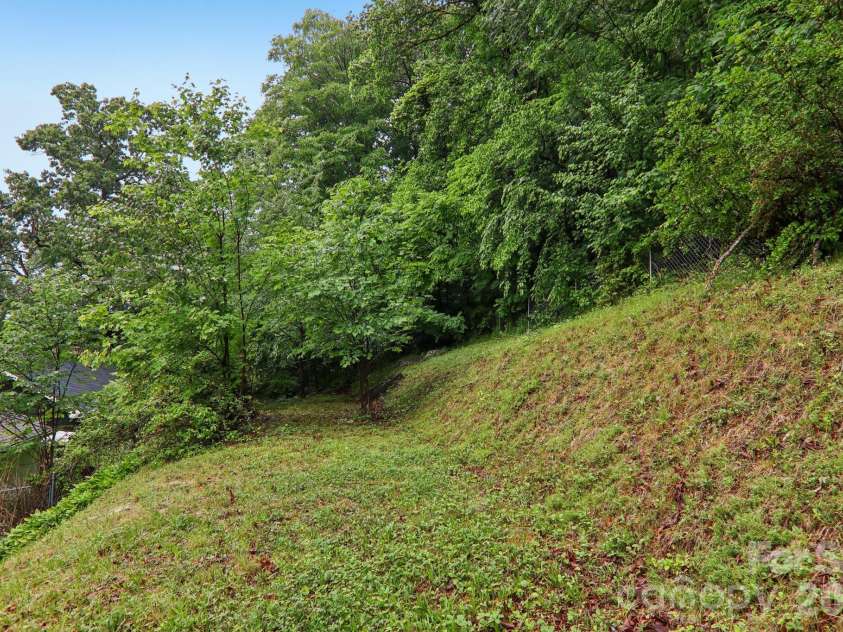 1157 Main Street, Waynesville, NC 28786.  MLS# CAR4385307, YatesRealty ID 37569. Upper back yar