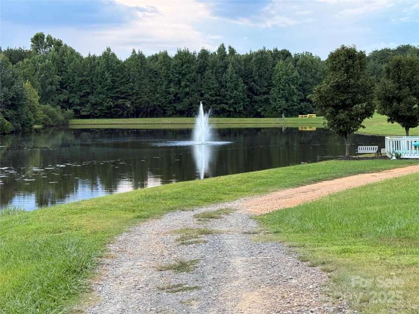 111 Club House Extension, New London, NC 28127.  MLS# CAR4295285, YatesRealty ID 3757. Catch and release fish pond with lighted aeration fountain lighted nightly