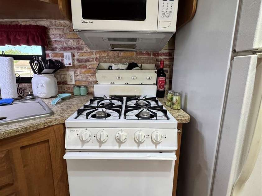 111 Club House Extension, New London, NC 28127.  MLS# CAR4295285, YatesRealty ID 3757. Full Height gas range and build-in Microwave