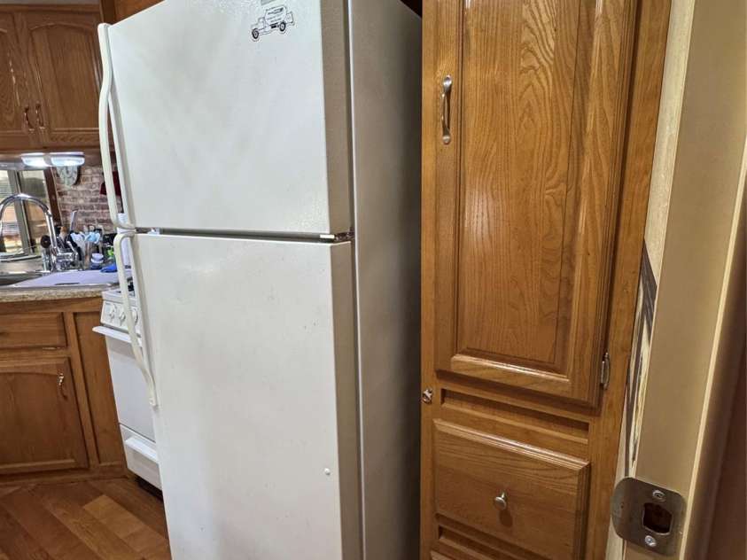 111 Club House Extension, New London, NC 28127.  MLS# CAR4295285, YatesRealty ID 3757. Full sized Refrigerator/freezer 