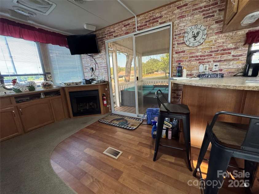 111 Club House Extension, New London, NC 28127.  MLS# CAR4295285, YatesRealty ID 3757. Living Kitchen overview