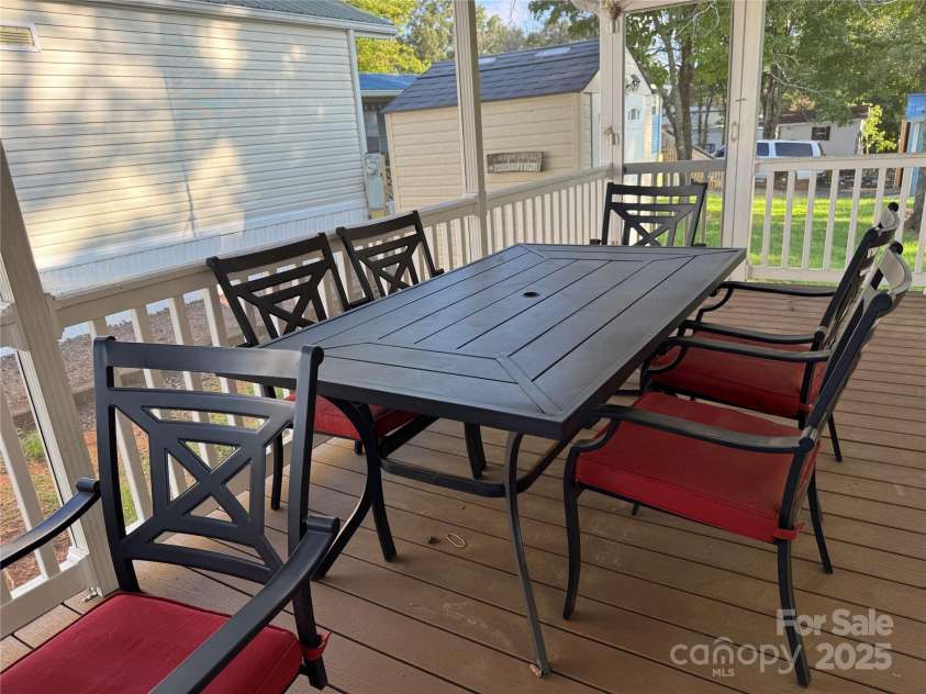 111 Club House Extension, New London, NC 28127.  MLS# CAR4295285, YatesRealty ID 3757. Plenty of porch space for outdoor dining 