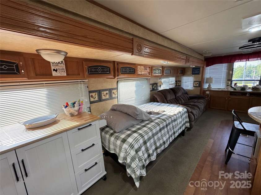 111 Club House Extension, New London, NC 28127.  MLS# CAR4295285, YatesRealty ID 3757. The living area extension is large enough for guest sleeping if needed