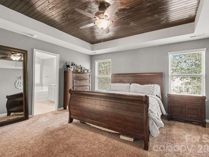 3324 Brackhill Street, Davidson, NC 28036.  MLS# CAR4428889, YatesRealty ID 37582. Primary suite with wood tray ceiling