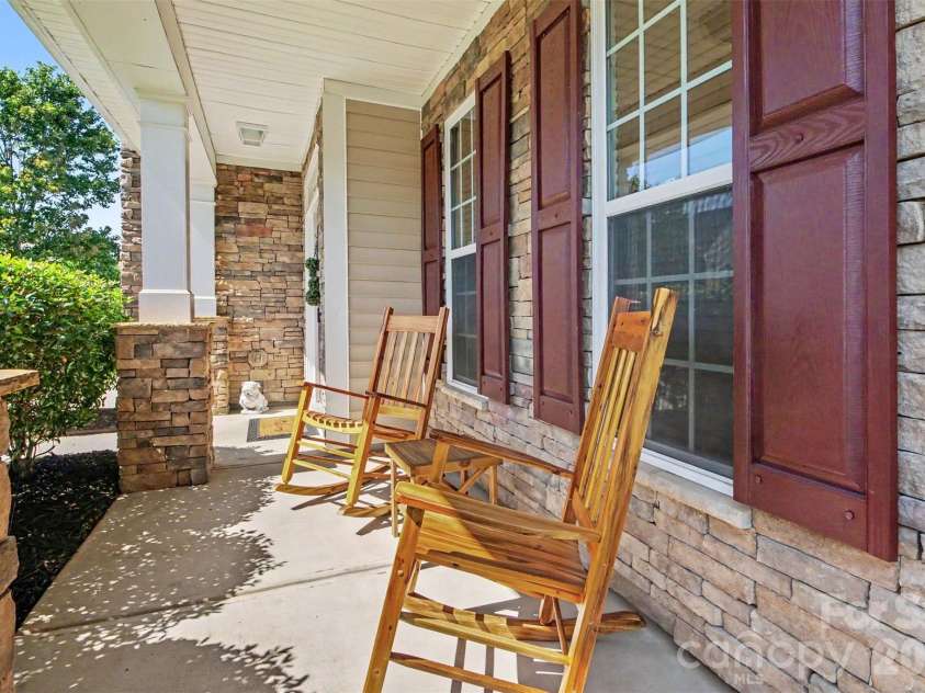 3324 Brackhill Street, Davidson, NC 28036.  MLS# CAR4428889, YatesRealty ID 37582. Rocking chair front porch
