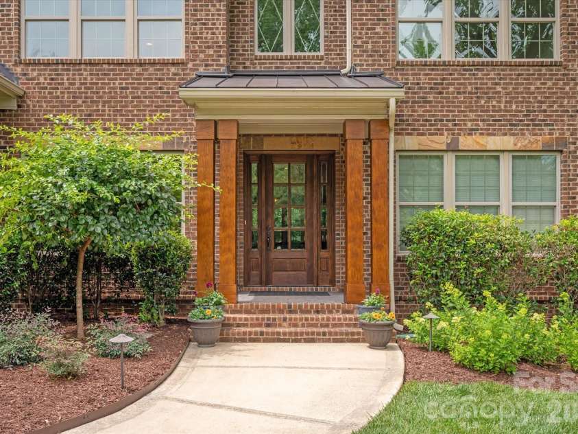 2020 Sherringham Way, Waxhaw, NC 28173.  MLS# CAR4390761, YatesRealty ID 37590. Covered front entry with new wood columns